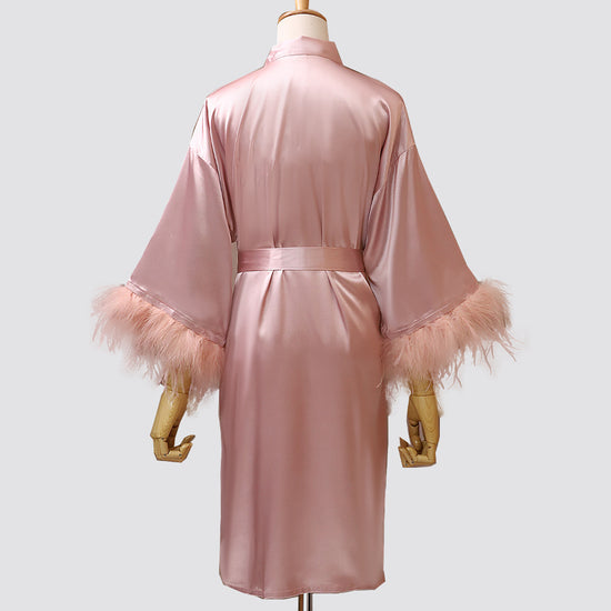 Blush satin bridal dressing gown with soft feather cuffs