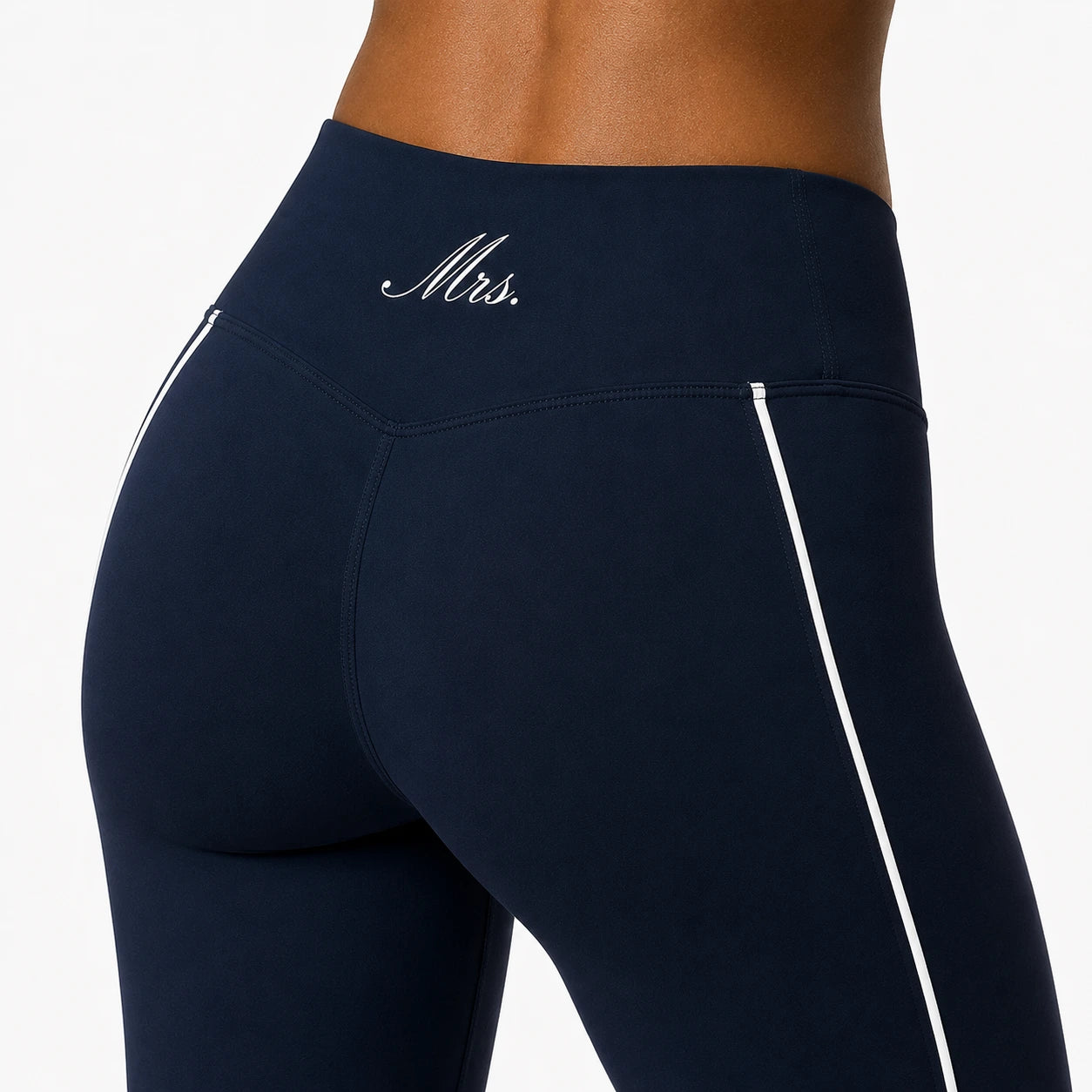 Navy blue leggings with 'Mrs.' print on a white background