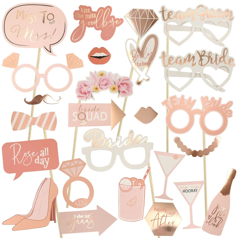 Collection of bachelorette and hen party photo booth props on sticks with various designs.