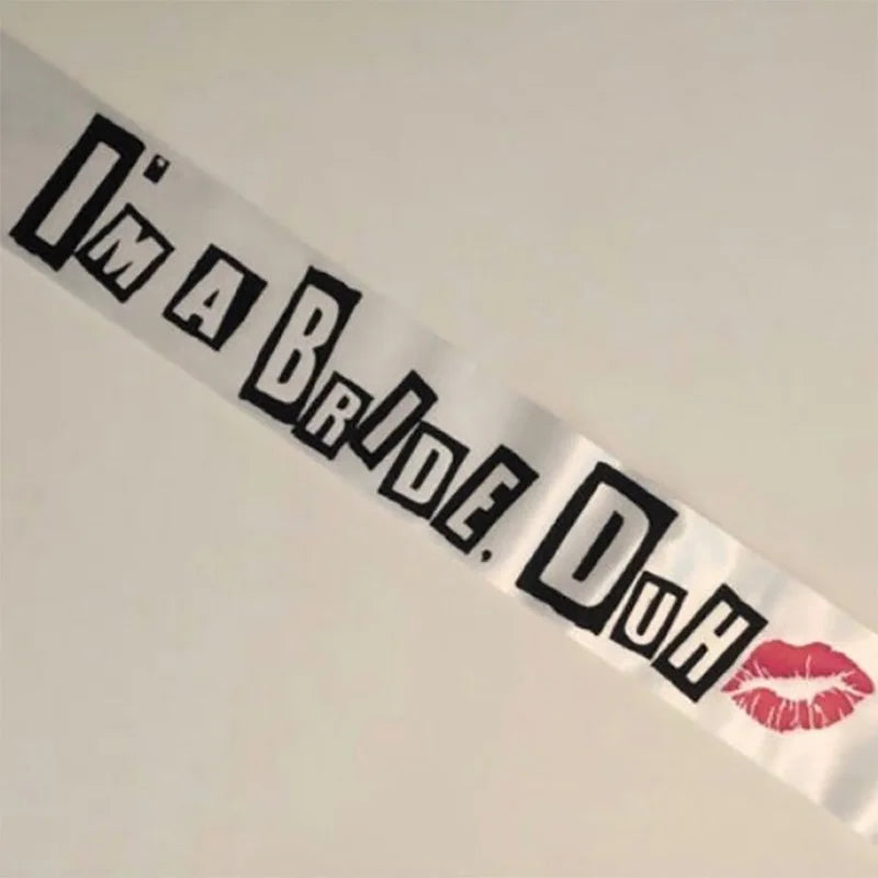 Sash with 'I'm a Bride. Duh' text and red lip print on a white background