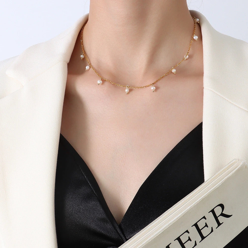 Pearl necklace on a model with a white background