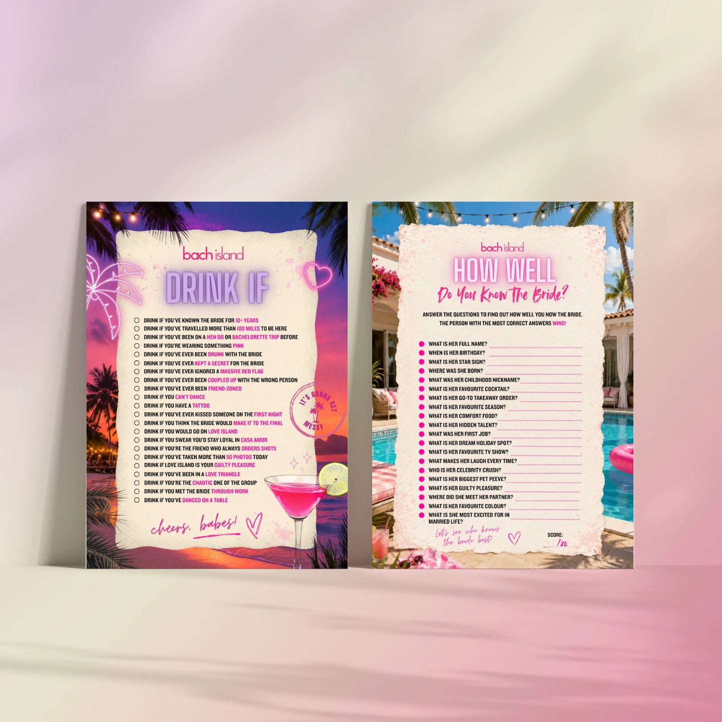 Two printed party game cards standing upright on a white surface against a soft pink gradient background. 