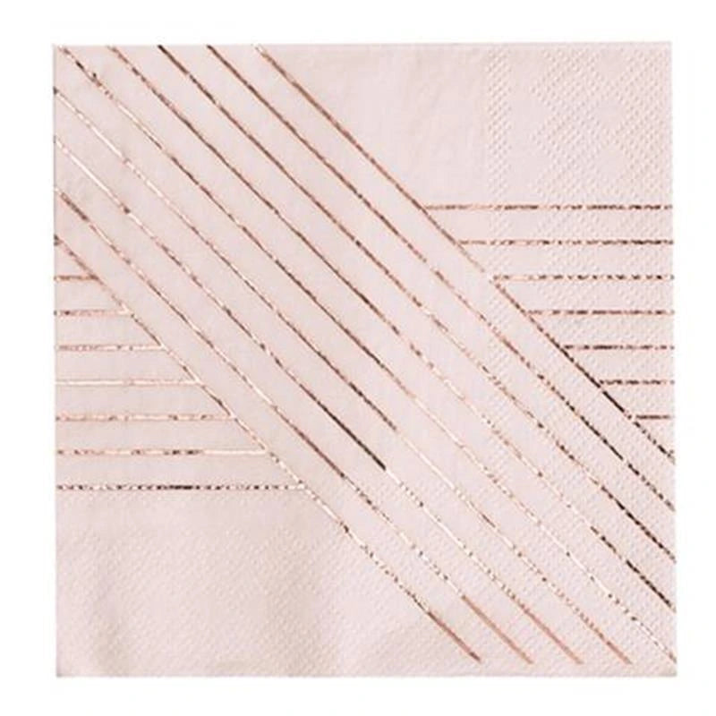 A close-up of a pale blush pink textured napkin with metallic rose-gold diagonal stripe patterns arranged in geometric bands.