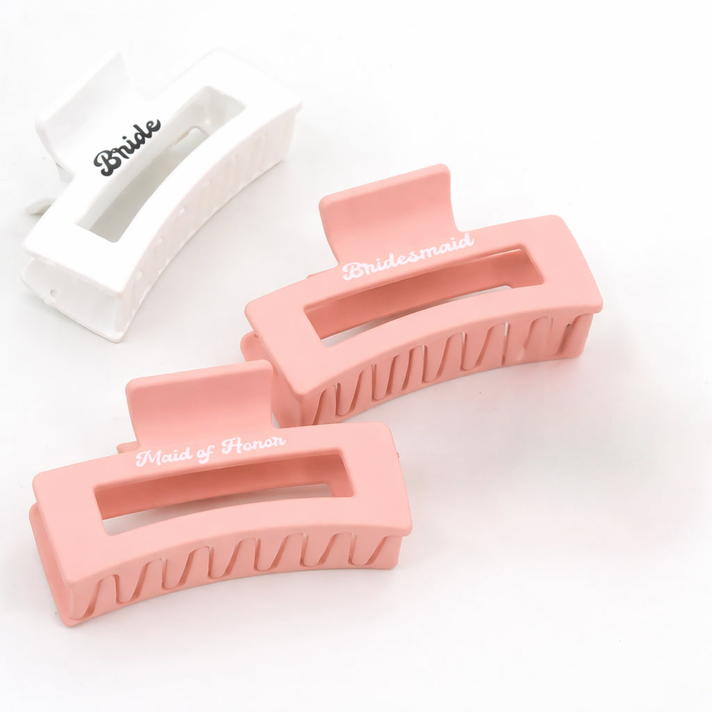 Bride, Bridesmaid and Maid of Honour hair claw clips in white and blush pink displayed on a clean white background.