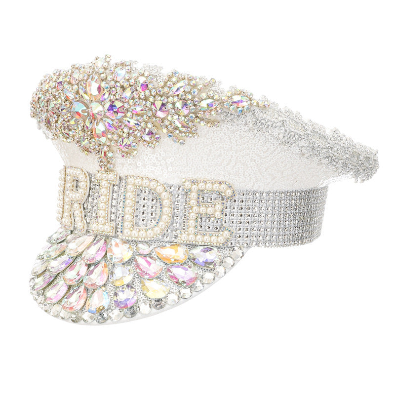 Angled view of an ivory white rhinestone bride captain hat showing the embellished brim.