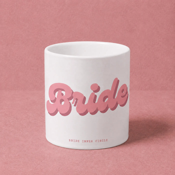 White mug with pink 'Bride' text on a pink background