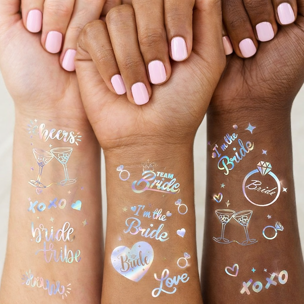 Three hands with temporary bridal tattoos on a neutral background
