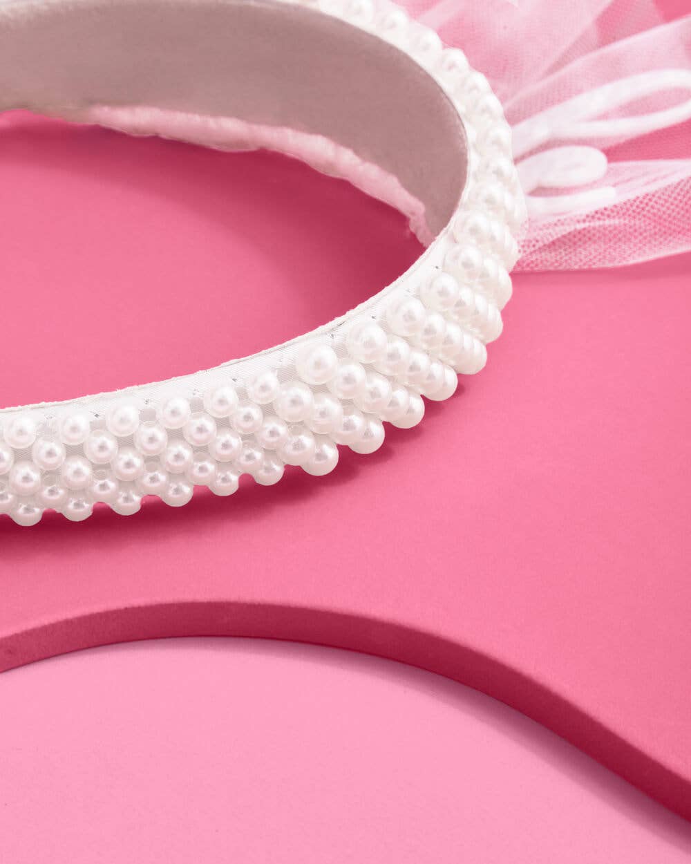 Pearl bride headband on a pink background
