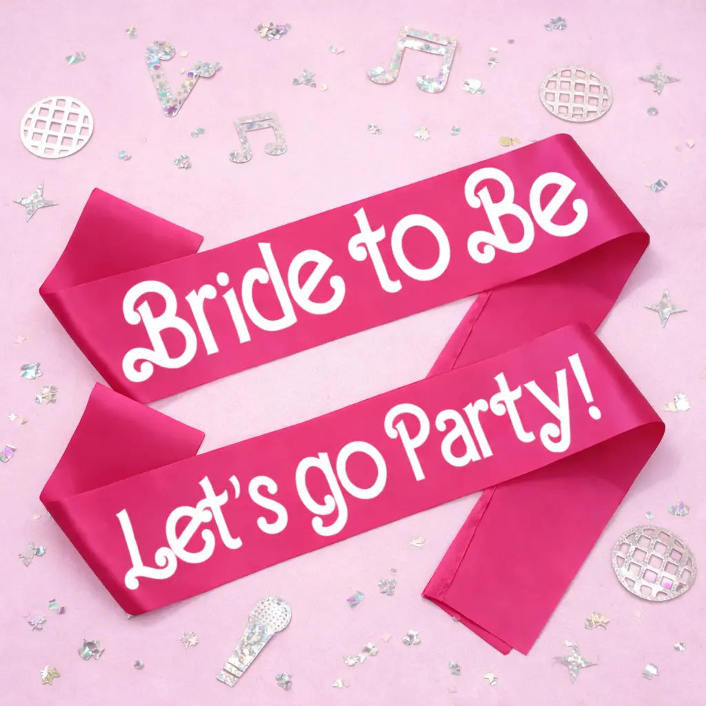 Pink sashes with 'Bride to Be' and ' Let's go Party!' text on a pink background with confetti.