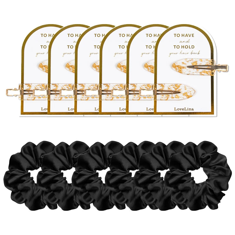 Set of black scrunchies with a hair clip and packaging on a white background