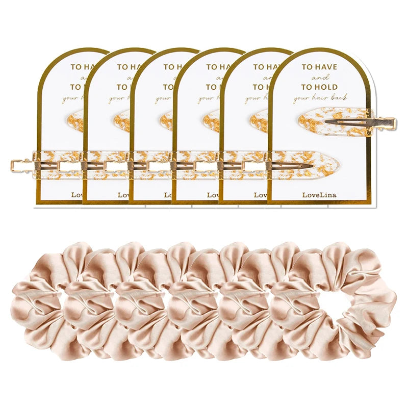 Set of hair accessories including a hair clip and scrunchies on a white background