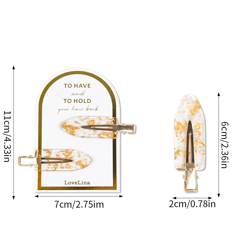 Hair clips with floral design and gold accents, shown with measurements on a white background.