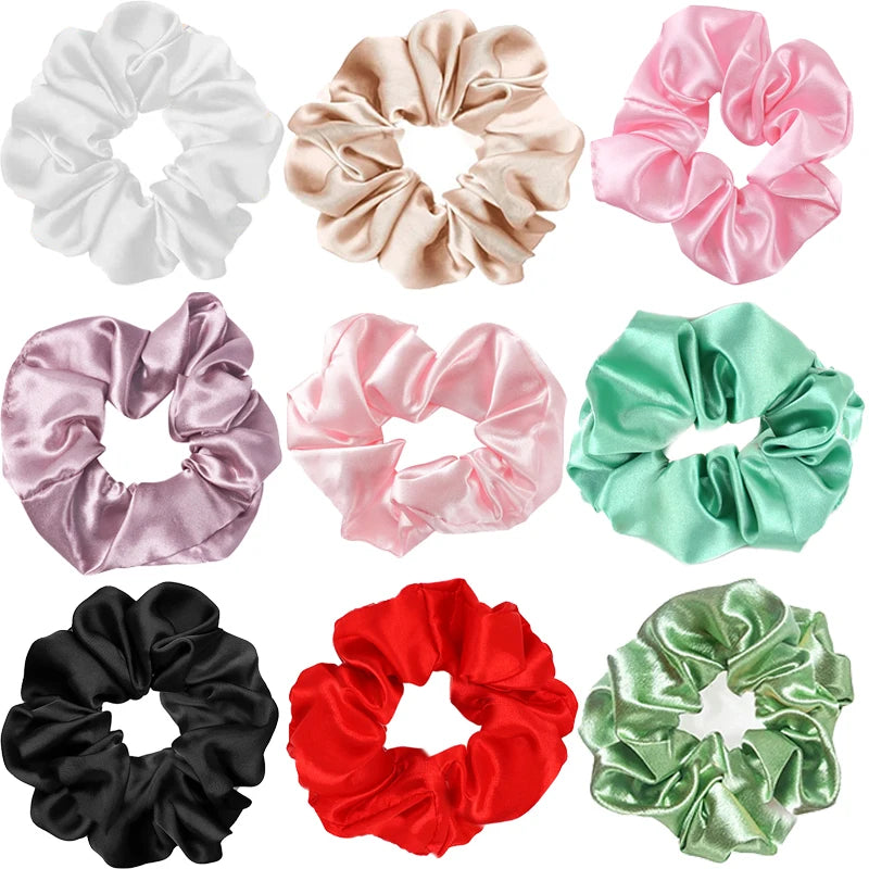 Collection of colorful satin scrunchies on a white background