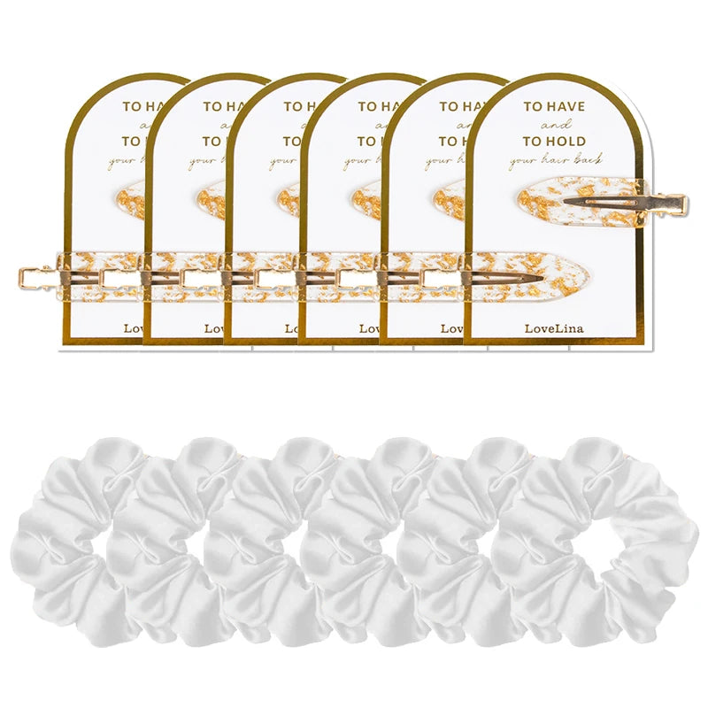 Set of hair accessories including clips and scrunchies on a white background