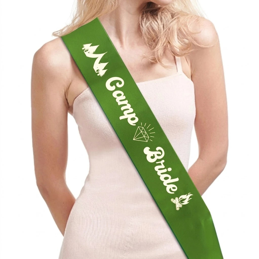 Green 'Camp Bride' sash worn by a person on a white background
