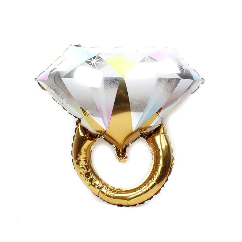 Gold ring-shaped balloon with diamond design on a white background
