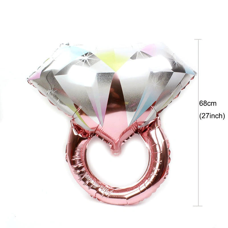 Rose gold ring-shaped balloon with diamond design on a white background