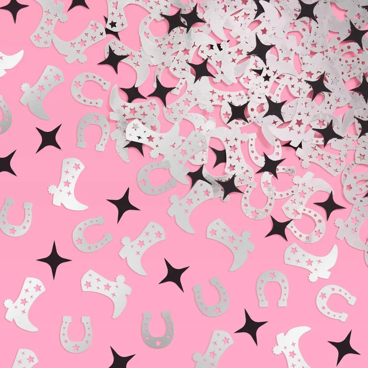 Pattern of cowboy boots, horseshoes, and stars on a pink background