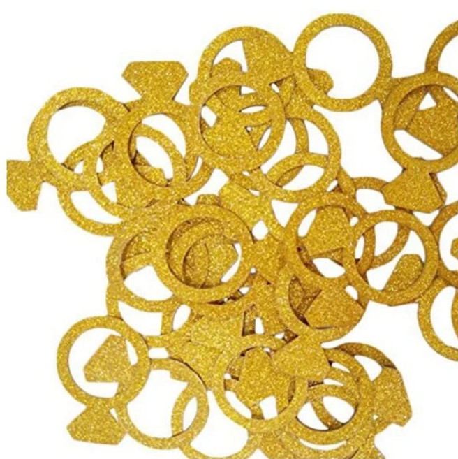 Gold glittery rings on a white background