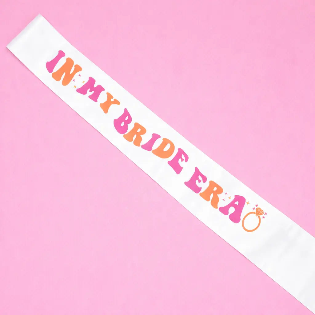 Sash with 'In My Bride Era' text on a pink background