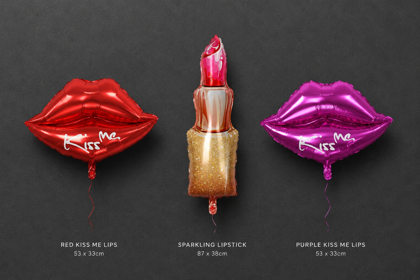 Three metallic foil party balloons shaped like lips and a lipstick, displayed on a dark gray background with size and color labels below each balloon. The left balloon is red and reads 'Kiss Me'; the center balloon is a glittery gold lipstick with a pink tip; the right balloon is purple and reads 'Kiss Me'.