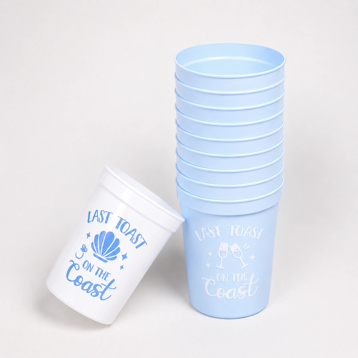 Stack of light blue cups with 'Last Toast on the Coast' text and design.