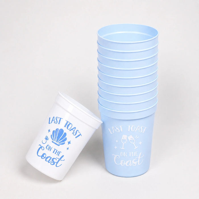 Stack of light blue cups with 'Last Toast on the Coast' text and design.