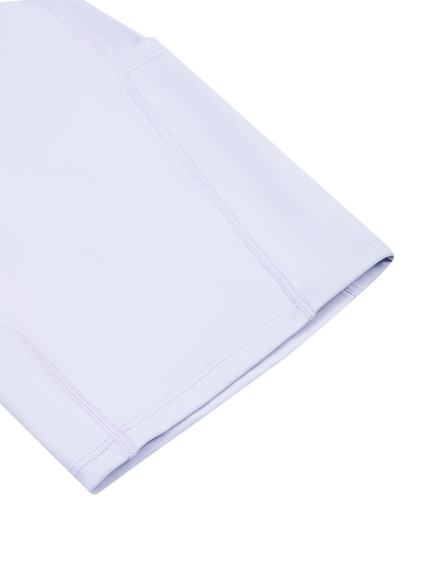 A close-up of a folded light lavender or pale purple fabric item, showing clean stitching and a smooth texture against a plain white background.
