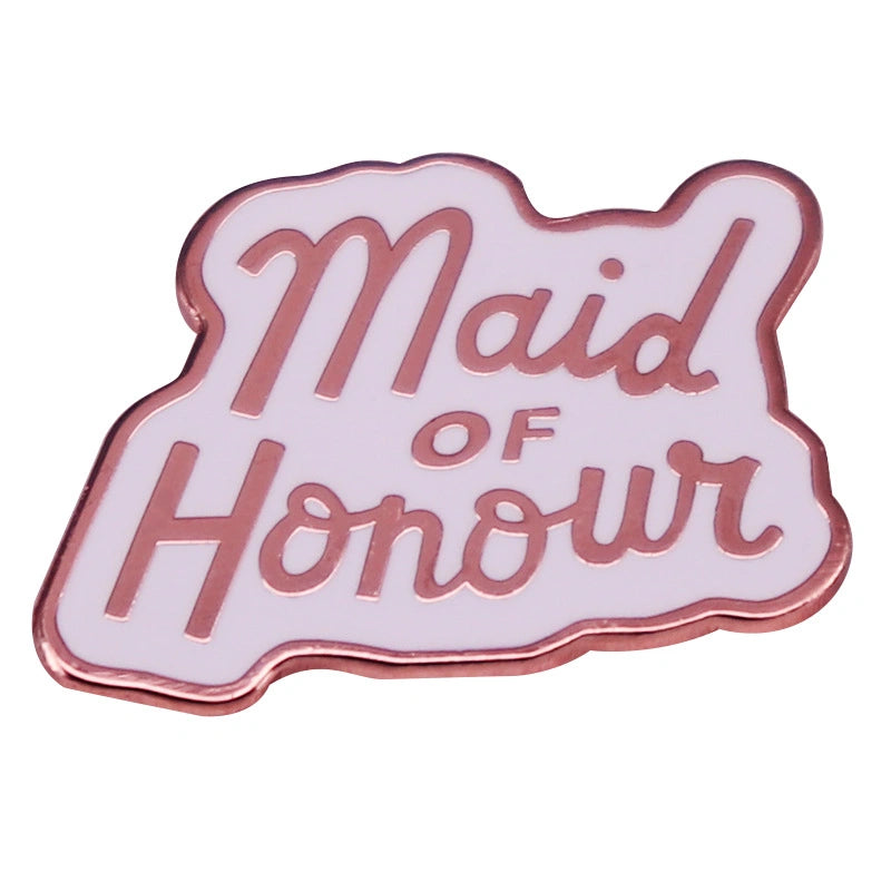A pink enamel pin shaped like a cloud, featuring the words 'Maid of Honour' in rose gold lettering, shown on a plain white background.
