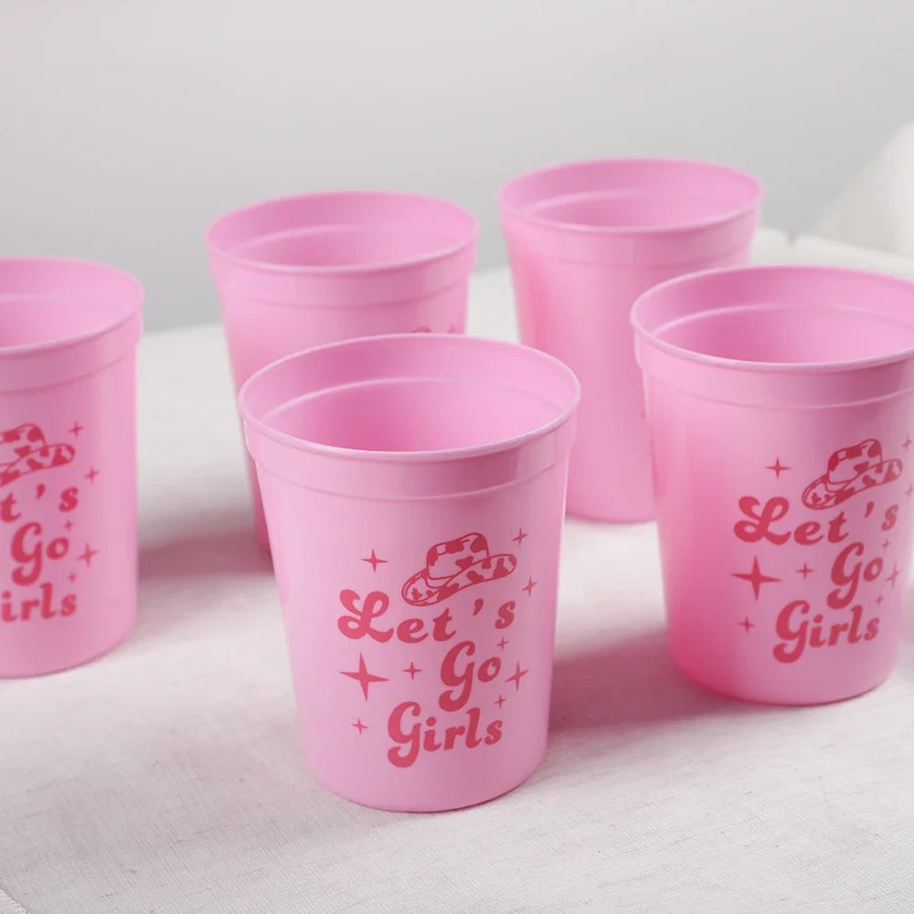 Set of pink cups with 'Let's Go Girls' text on a white background