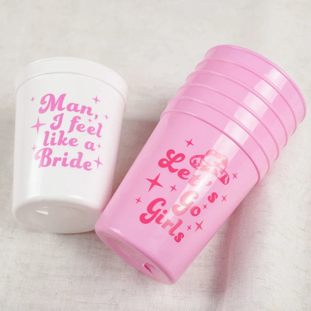 Two tumblers with humorous text designs on a light background