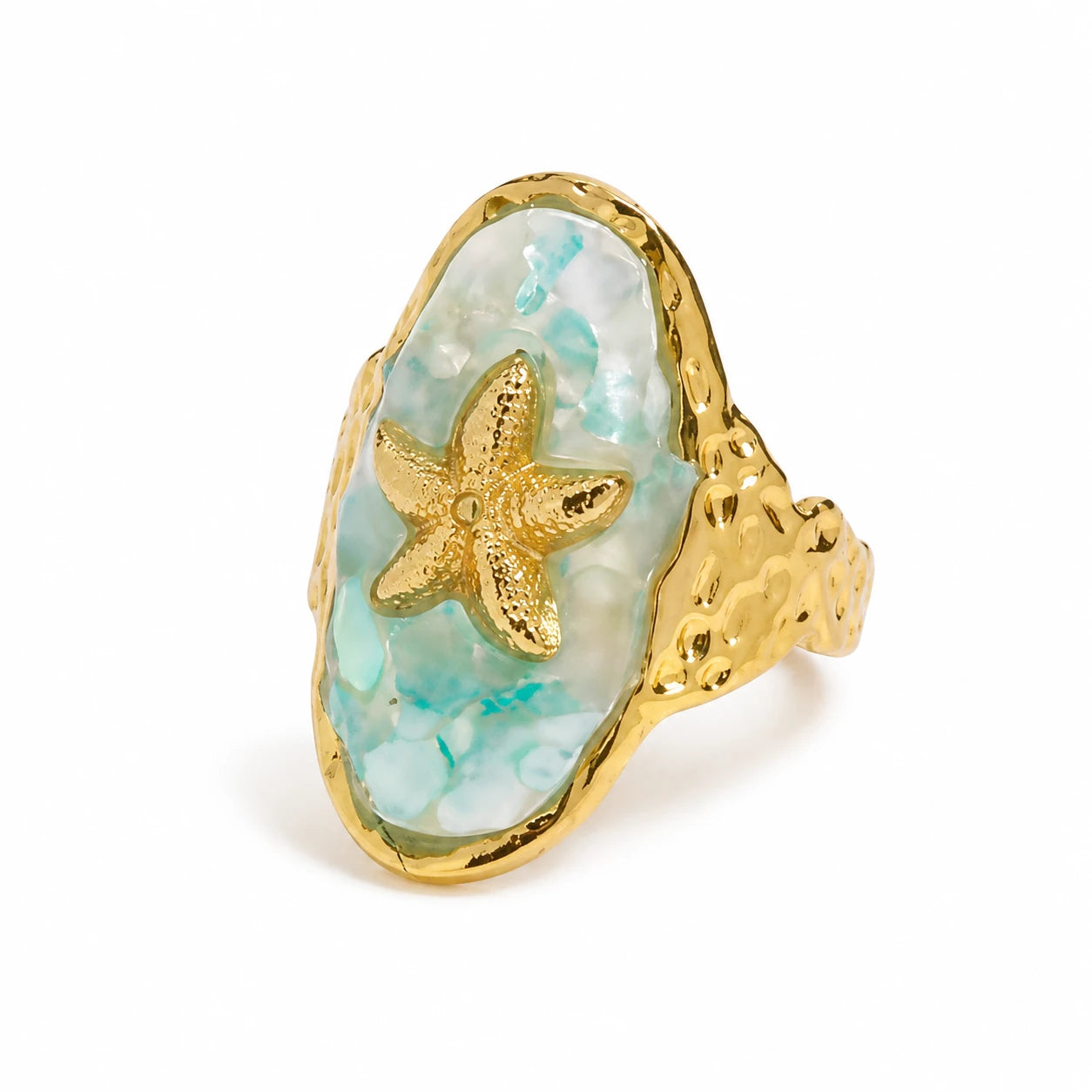 A gold ring featuring a large, irregularly shaped turquoise-blue mother-of-pearl cabochon with a textured gold starfish inlaid in the center, set against a plain white background.