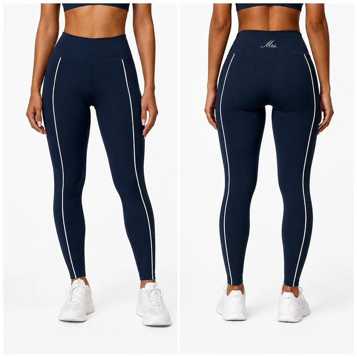 Navy leggings with white 'Mrs.' accents worn by a person on a white background