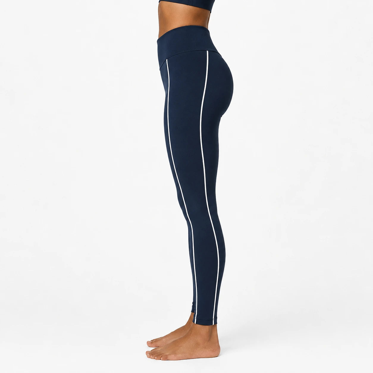 Navy leggings with white stripes on a white background