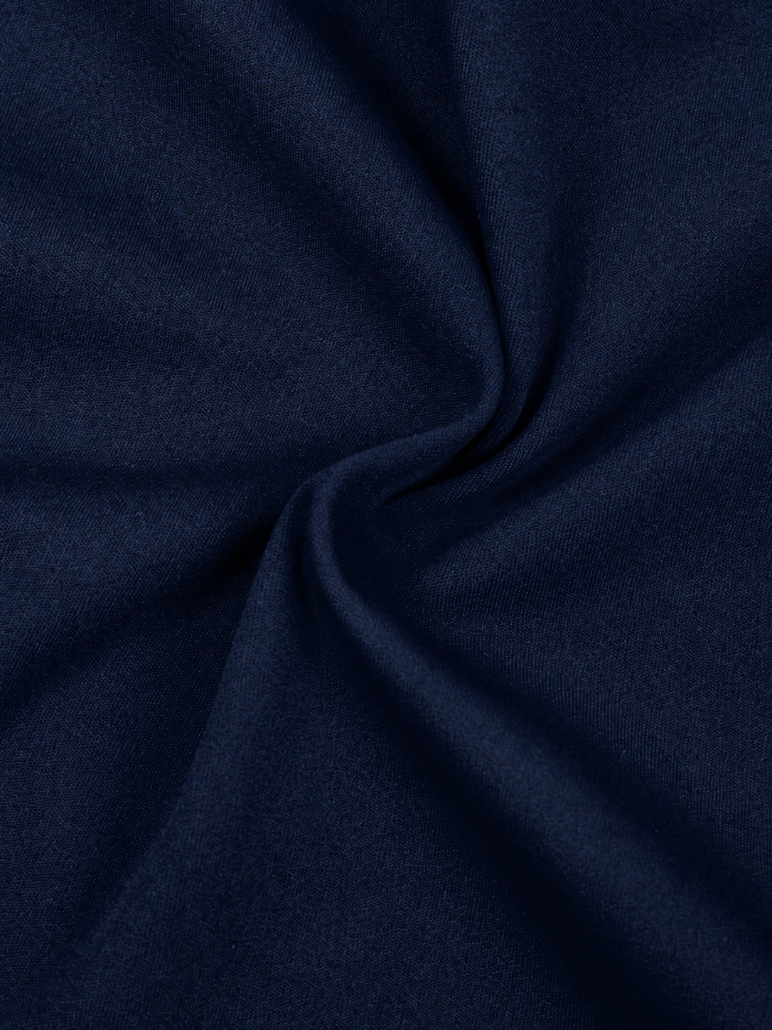 Close-up of dark blue fabric with folds