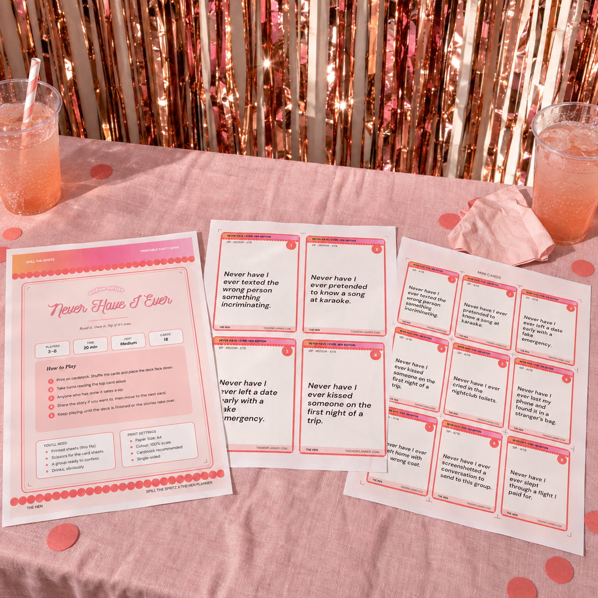 Never Have I Ever printable hen party game cards displayed on a pink party table
