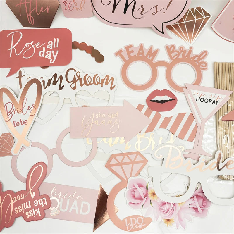 Collection of bridal shower and hen party photo props decorations on a white background - The Hen Planner