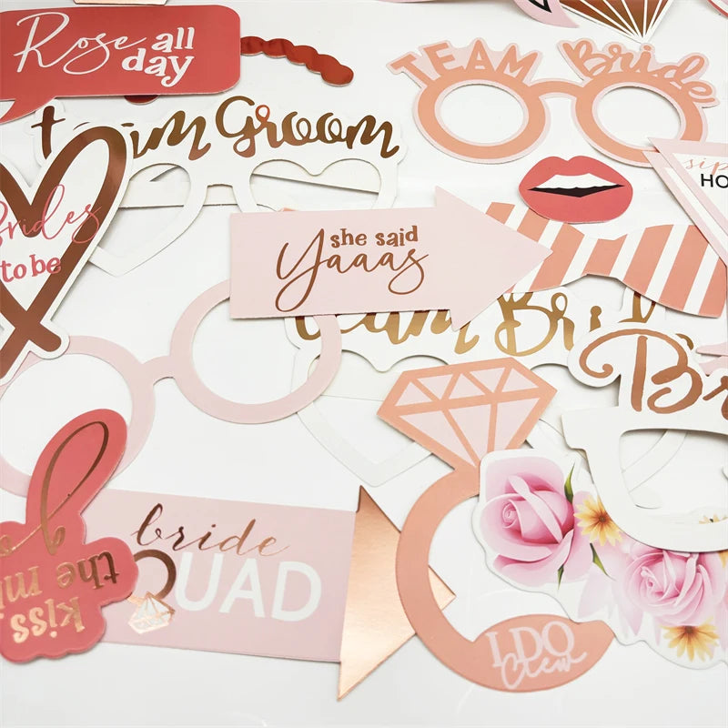 Collection of hen party and bachelorette party props including glasses, signs, and decorative items on a white background - The Hen Planner