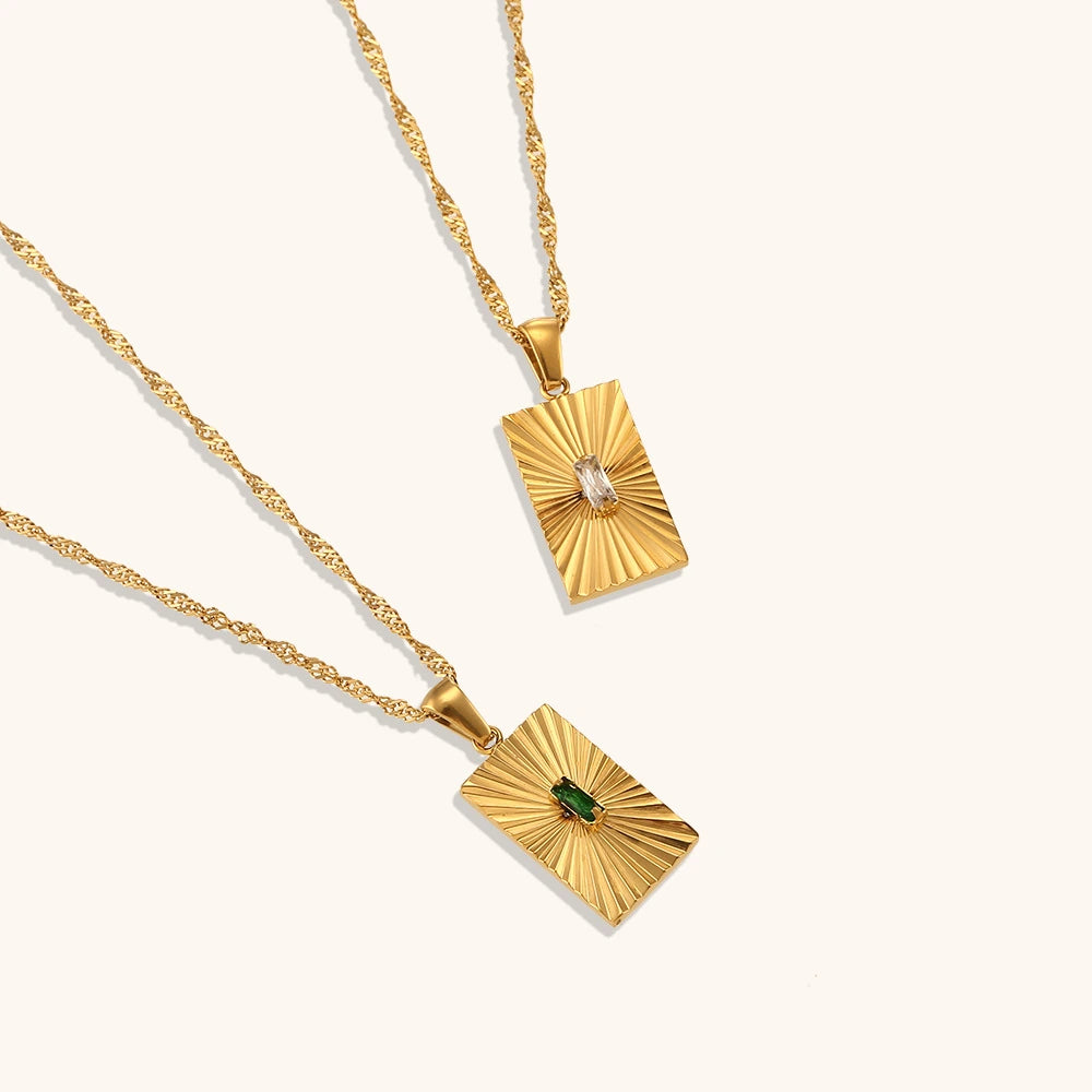 Solara Radiance 18K gold plated sunburst necklace with emerald green or crystal white centre stone, suitable as a bride or bridesmaid gift.