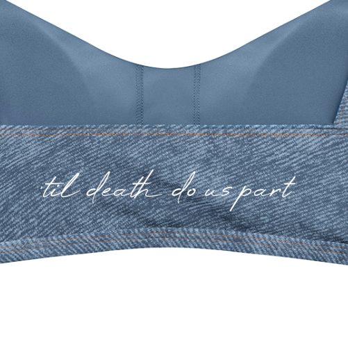 Close-up of a blue bra with a textured denim-like band featuring the white script text 'til death do us part' across the center.