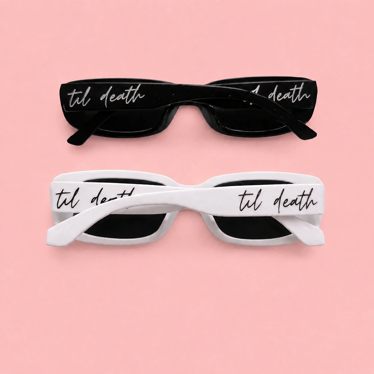 Two pairs of sunglasses with 'til death' text on a pink background