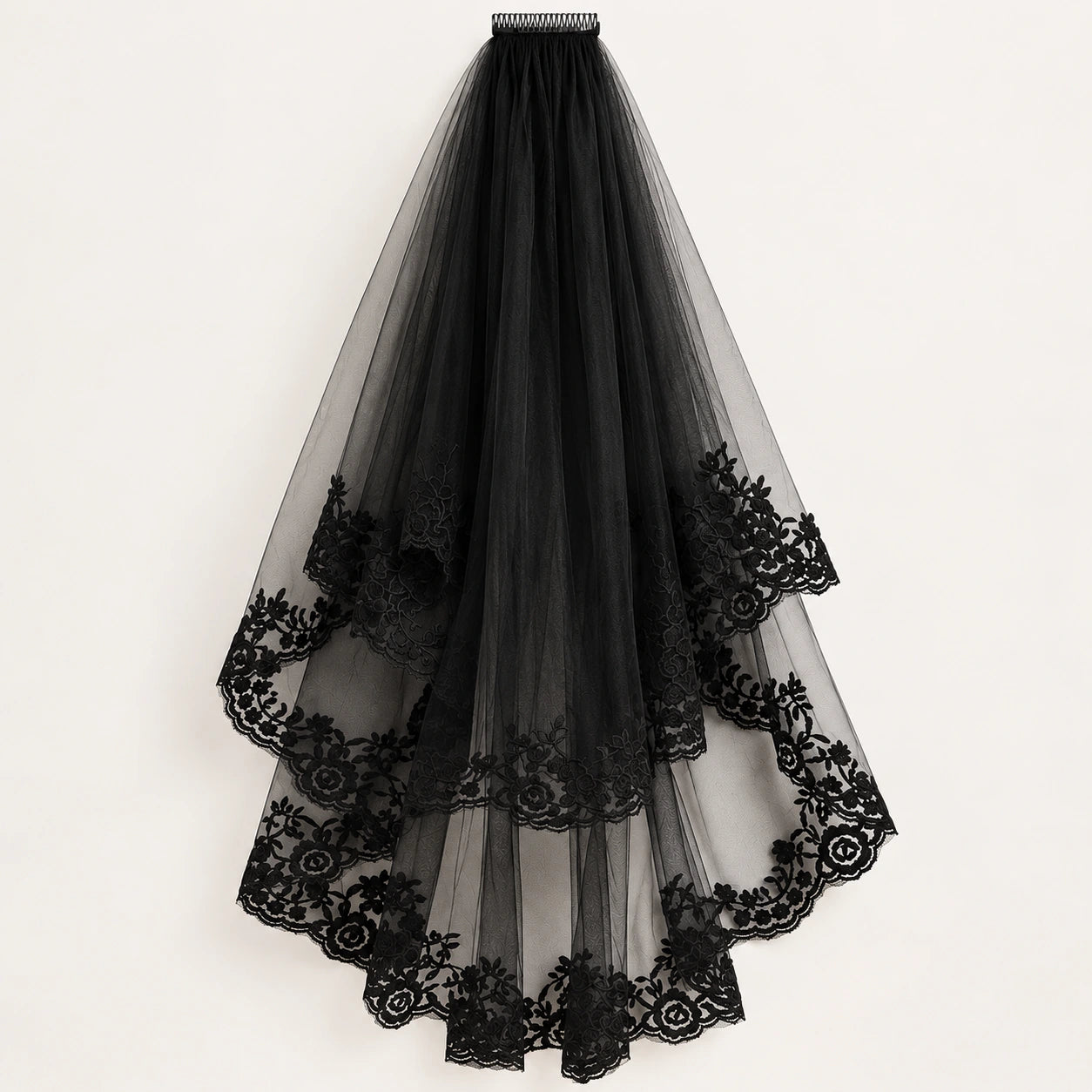 A long black tulle veil with intricate floral lace trim.