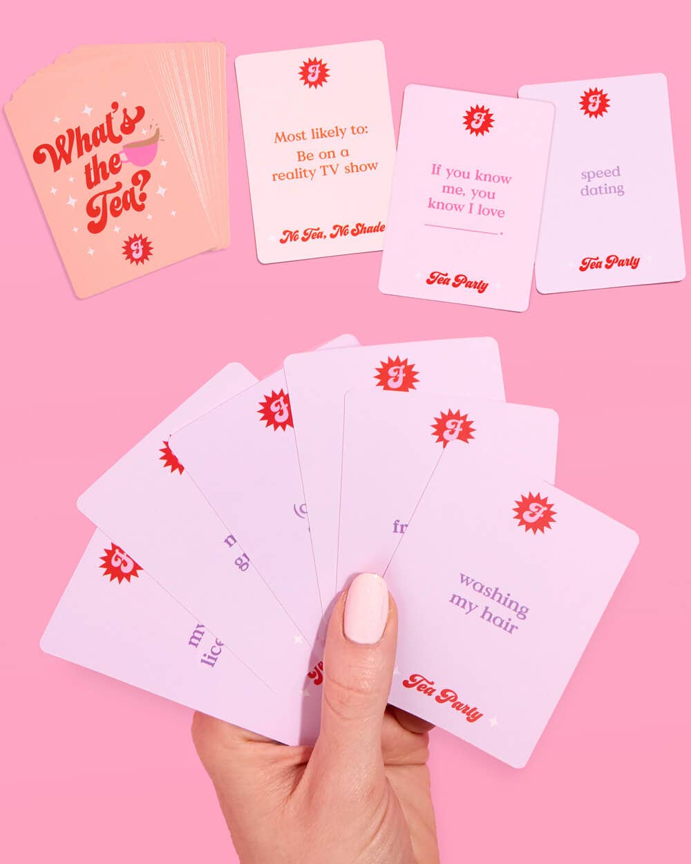 Hand holding What’s the Tea answer cards for girls night and bachelorette party game
