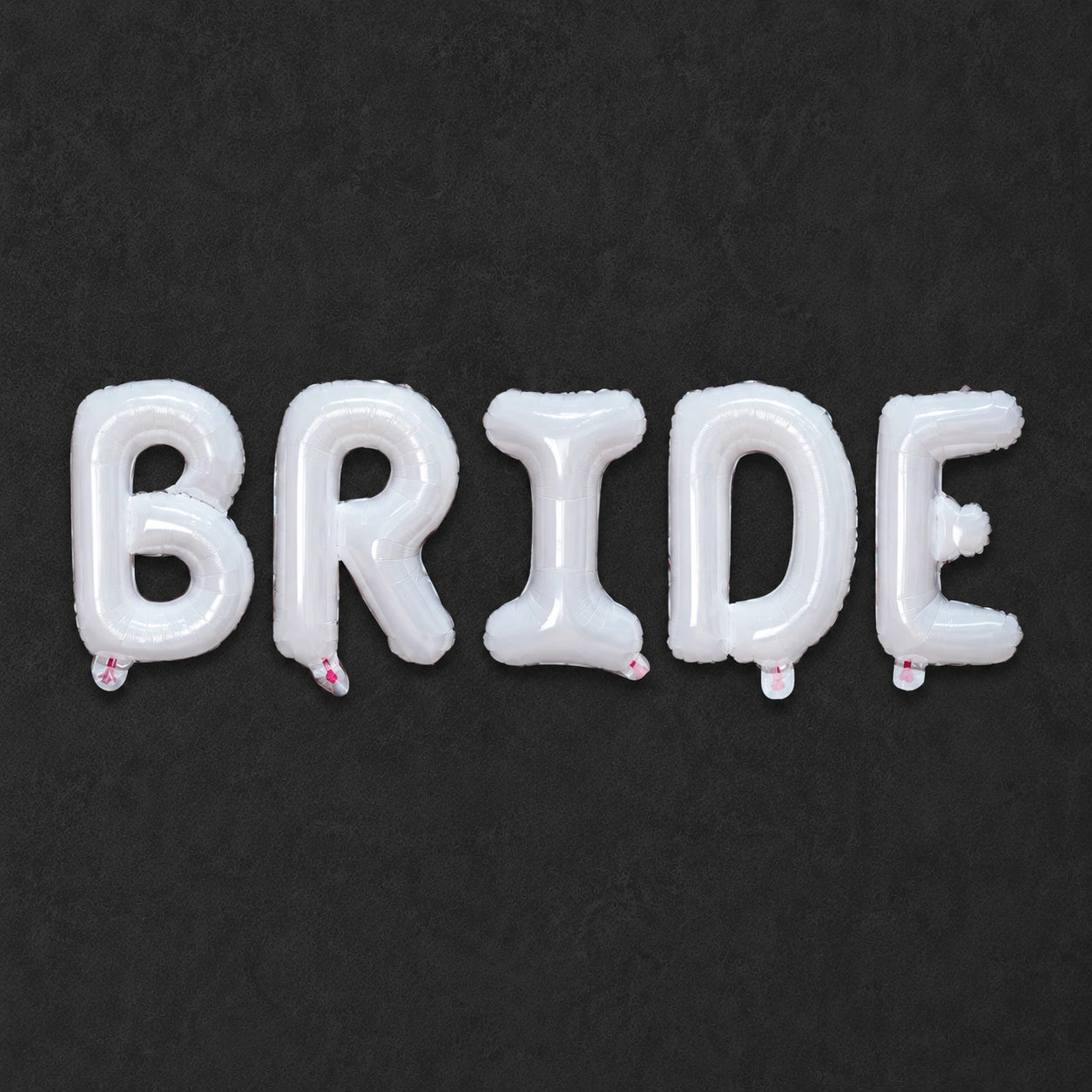 Balloon balloons spelling 'BRIDE' on a black background