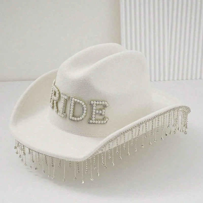 White cowboy hat with 'BRIDE' embellishments on a white background