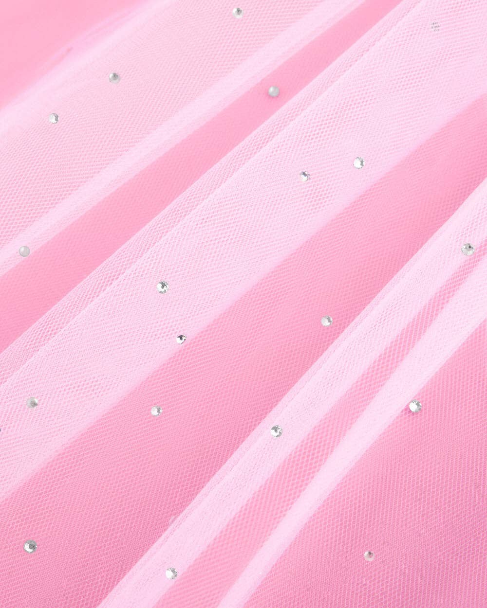 Close-up of white tulle bridal veil with rhinestone accents for bachelorette party and bride outfit