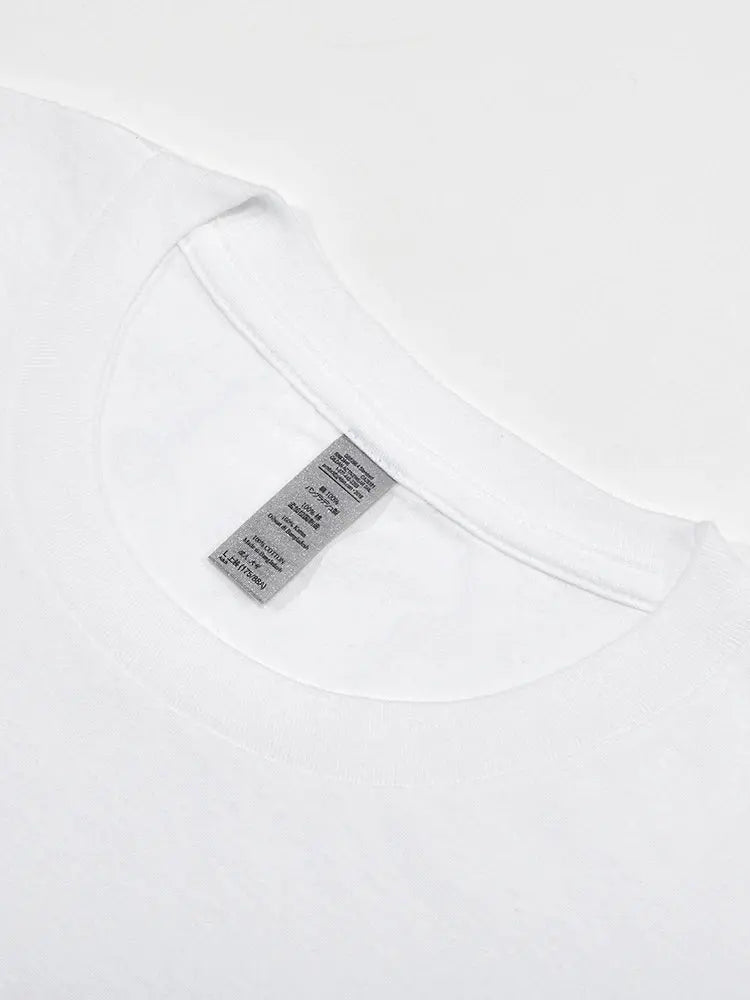 Close-up of a white shirt with a label on a white background