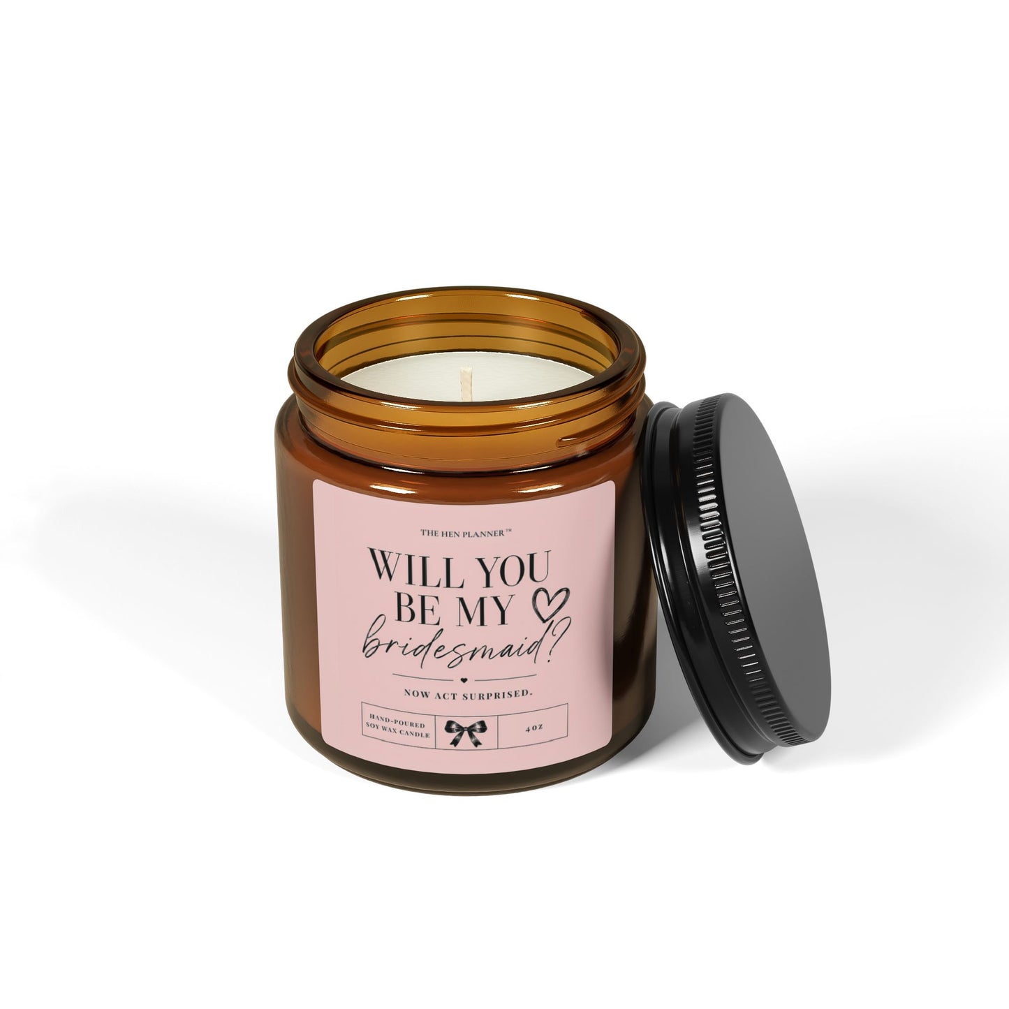 'Will You Be My Bridesmaid' candle in an amber jar with a decorative label on a white background